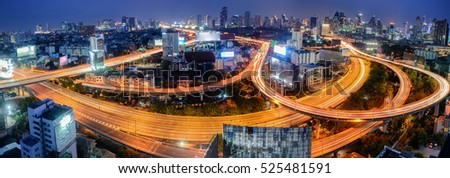 Top View Highway road curved long exposure .Panoramic and perspective wide angle high rise building skyscraper commercial city of future. Business concept of success industry tech architecture