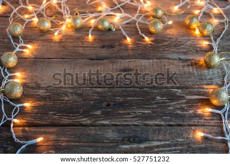 Christmas Lights and Decoration on Wooden Background. Horizontal