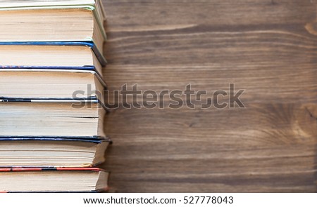 Old books on wooden background