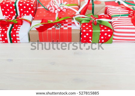 Red gift box with colorful ribbons. White background. Gifts for Christmas.