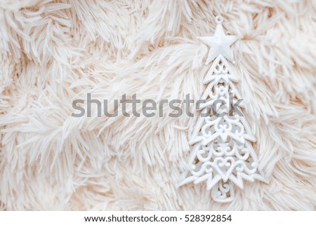 toy white tree on a background of soft light plaid