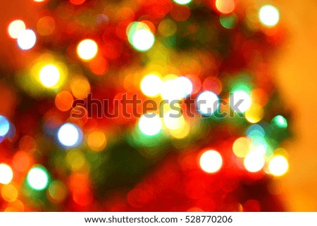 Close up macro shot of Christmas tree color lights with globes and decorations 