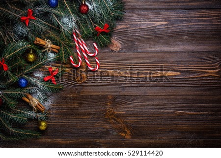 Christmas wooden background decorated by snow tree and gifts with copy space