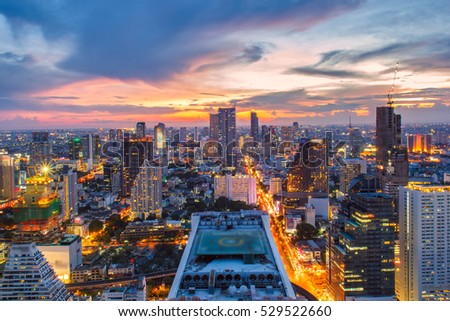 Bangkok City skyline aerial view at sunset with colorful clouds and skyscrapers of midtown bangkok.