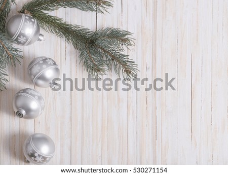 Christmas decoration with Christmas silver balls on wooden background