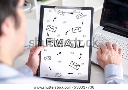 Man holding a clipboard with email concept