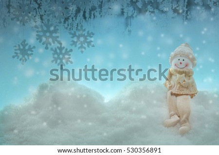 Christmas snowman on snow winter blue background with snowflakes.