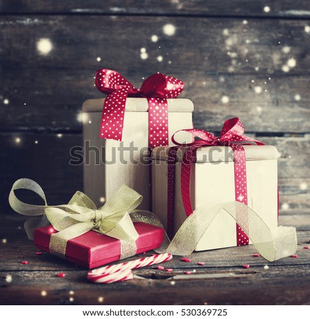 Vintage christmas gift boxes on wooden background/ holidays gift background
