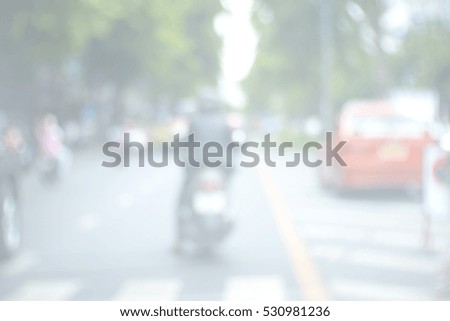 Blurred abstract background and can be illustration to article of People crossing a street crosswalk