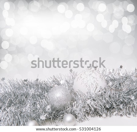 White Christmas background with white Christmas balls, silver tinsel and  highlights