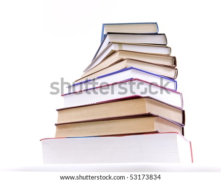 A lot of books, tower made of books against a white background