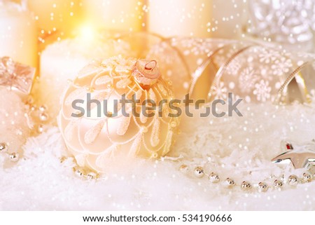 Christmas background: beautiful christmas decorations and candles in the snow. 