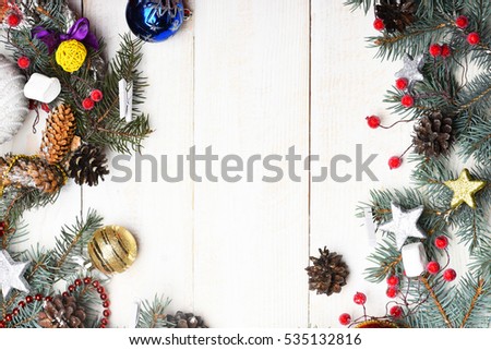 set of christmas or new year decoration with green fir tree with silver golden stars and pine cones on white vintage wooden background, copy space