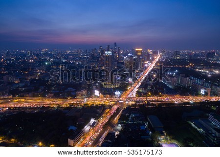 Aerial view at twilight and light of traffic in Bangkok, Thailand.