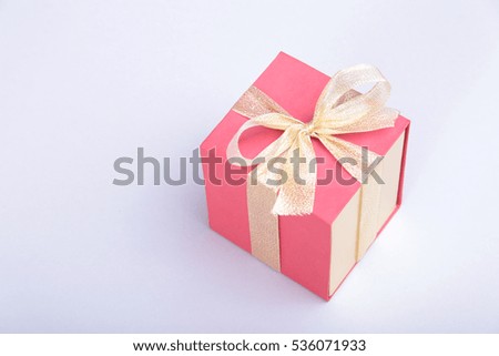 Gift boxes with bow on wood background.