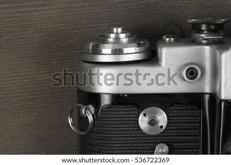 part of the rangefinder classic manual film camera on wood background