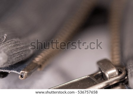 zip close up macro on clothes background