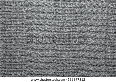 Wool hand-knitted Pattern. Closeup Fabric Background