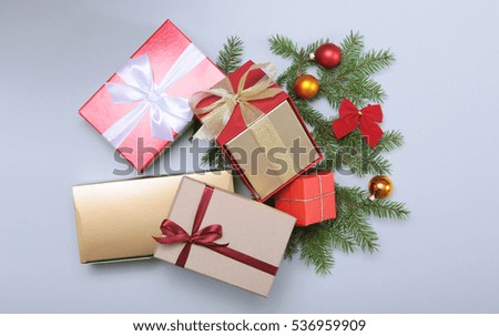 Gift box with christmas tree on wood background