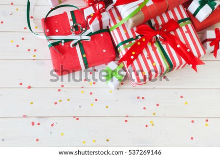 Red gift boxes with colorful ribbons. White background. Gifts for Christmas.