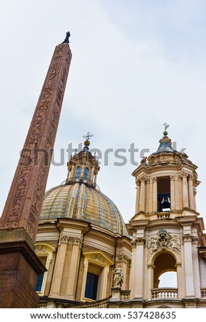 Vertical shot of an ancient Egyptian obelisk standing in Rome after being taken from Egypt during the Roman conquest.