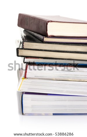 Stack of various books on white background.