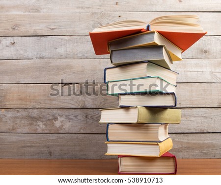 Open book on the wooden background