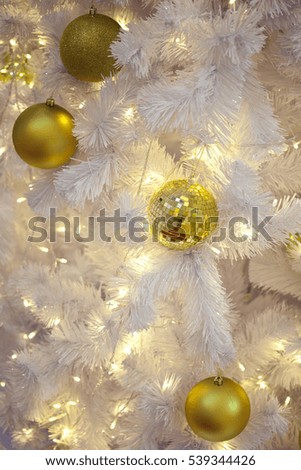 Christmas decorations on the white branches fir