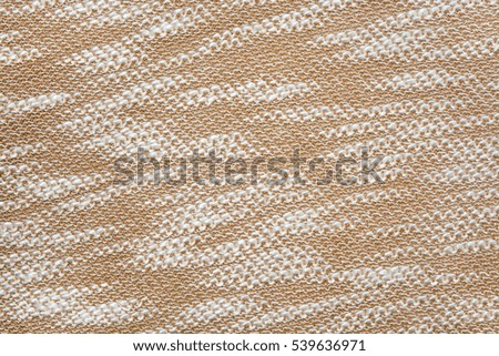Beige knitted texture background