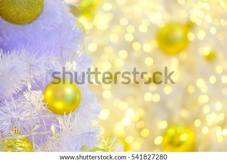 Circle golden ornament on white fuzz and bokeh light background.