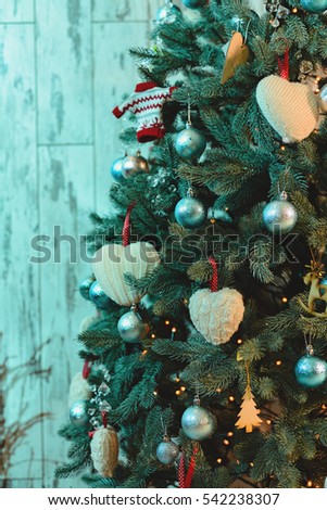 Christmas tree with garlands and toys. Toning.