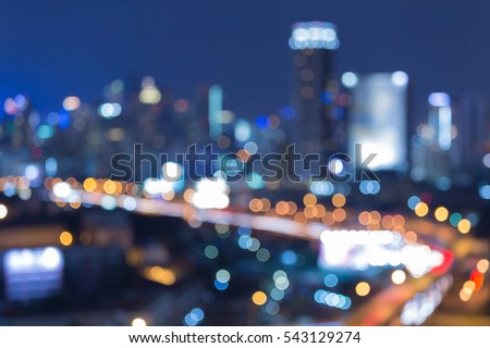 Twilight blurred bokeh lights city downtown, abstract background