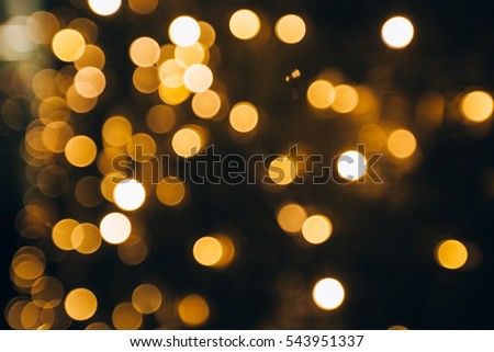 Sparkling background made of lights. Festive blurred backdrop for holidays and parties.