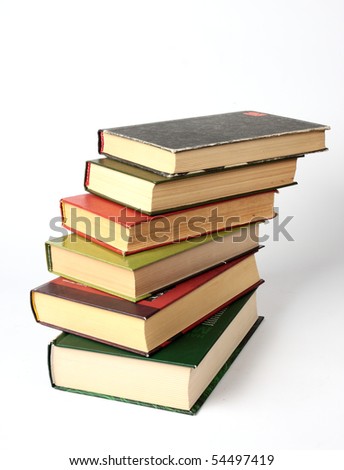 Stack of different sizes of books on white background
