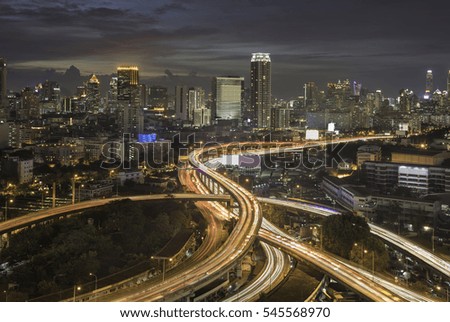 Aerial view of Bangkok cityscape and Expressway at sunset. Thailand