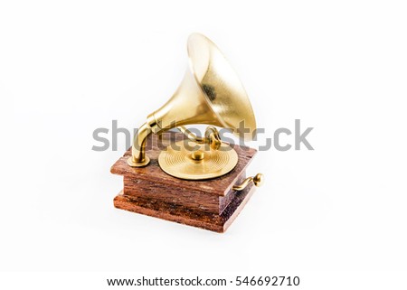 Golden gramophone on white background