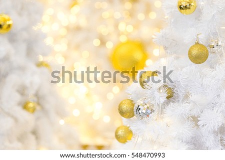 Christmas ornaments on the Christmas tree with bokeh background.