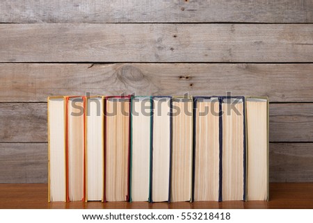 Old books on the wooden background