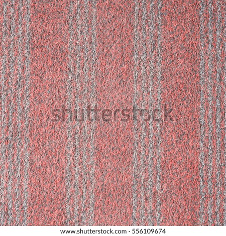 Vertical striped red carpet surfaces.
