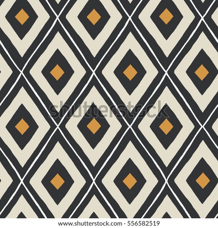 Ethnic seamless pattern in black, gold and cream.