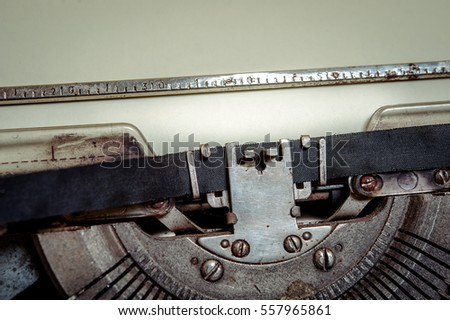 Close up image of Typewriter with moving typebar and paper sheet. Space for your text. Vintage retro writing machine.  hero header. technology is getting older. 