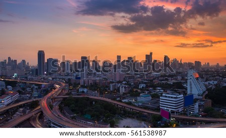 Sunset over city downtown skyline and highway intersection, Bangkok Thailand