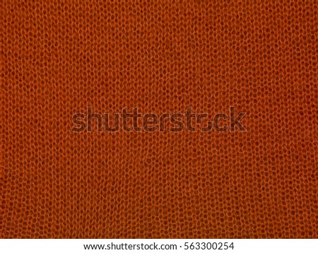 red wool sweater, close up background