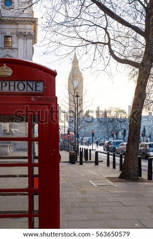 Traditional London red phone box and Big ben in early winter morning