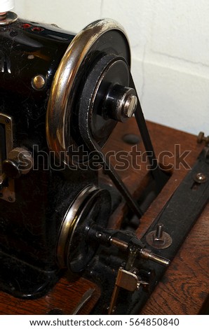 Power wheel of an old sewing machine, Berlin, Germany