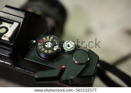 Close up of analog film camera on wooden background