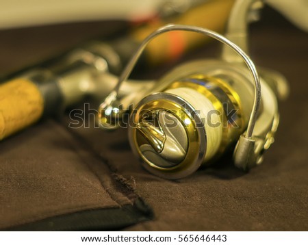 Fishing reels on the rod closeup