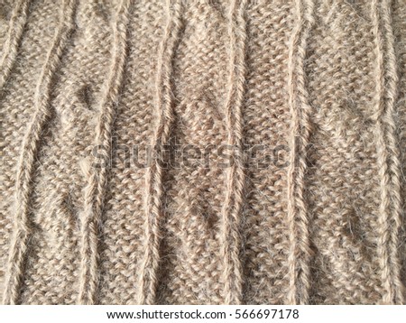 Beautiful crafted gray wool knitted background, natural soft surface
