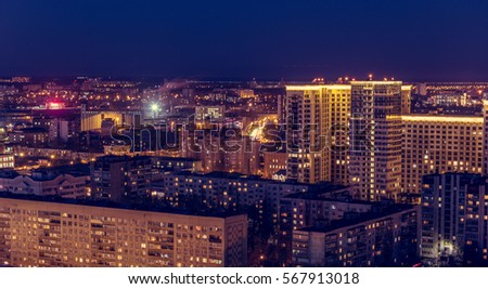 Voronezh downtown. Night cityscape from rooftop. Modern houses, hotels, streets, night lights