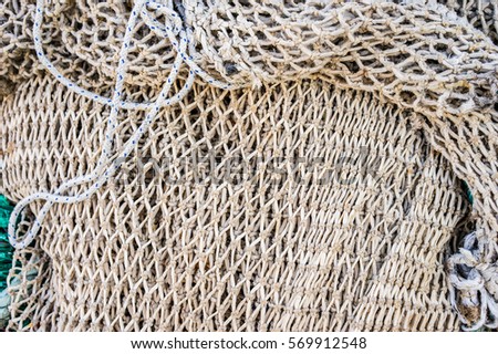 Gray fishing net, close-up, background texture.